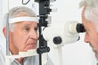 © WavebreakMediaMicro - Optometrist doing sight testing for senior patient