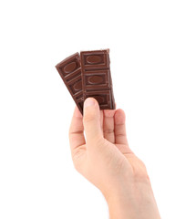 Poster - Hand holds dark chocolate bars.