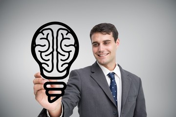 Poster - Composite image of businessman drawing light bulb