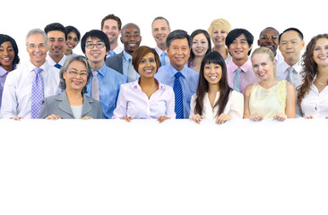 large group of business people holding board