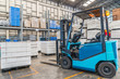 © ake1150 - forklift in the large modern warehouse