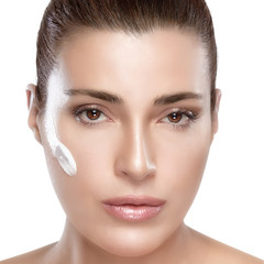 Wall Mural - spa girl with cream on her face. skincare concept