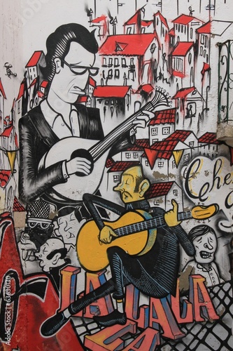 Obraz w ramie Anonymous graffiti shows singer traditional portuguese fado. 