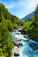 vivid swiss landscape with pure river stream