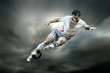 © Andrii IURLOV - Football player with ball on field of stadium