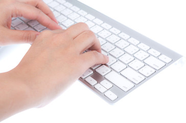 Closeup of business woman hand typing on laptop keyboard with mo