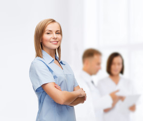 Wall Mural - smiling female doctor or nurse