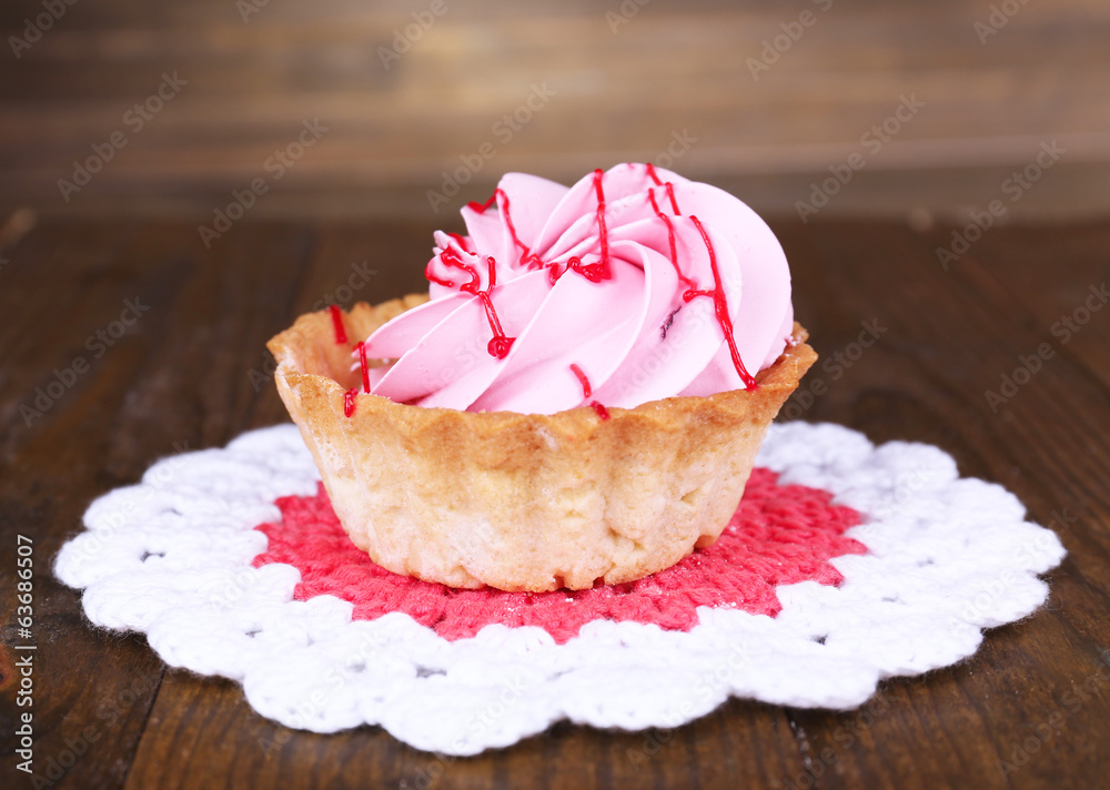 Tasty cake on table on wooden background