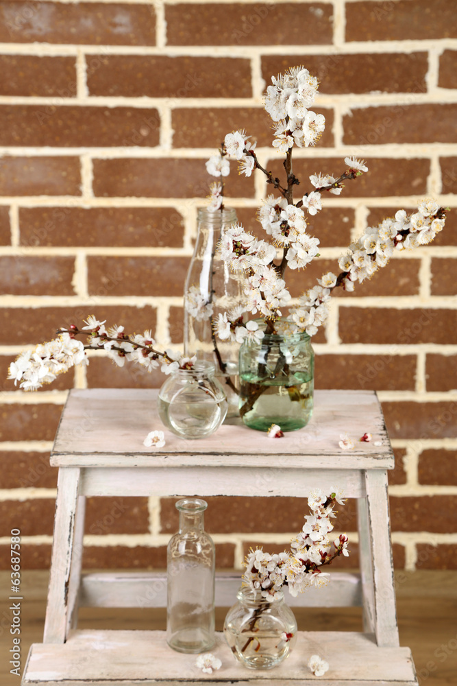 Beautiful apricot blossom in transparent jars