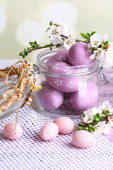 Wall Mural - Composition with Easter eggs in glass jar and blooming branches