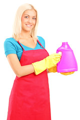 Poster - Young woman holding a bottle of cleaning solution