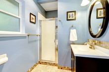 Light Blue Bathroom With Tile Trim