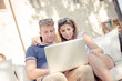 © Riccardo Piccinini - couple surfing on the web at resort