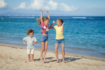 happy kids playing on beach