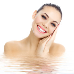 Cheerful female with fresh clear skin, white background