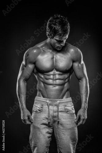 Naklejka ścienna Strong Athletic Man Fitness Model Torso showing six pack abs.