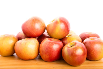 Wall Mural - Fresh Red Apples on a Wood Table with White Background