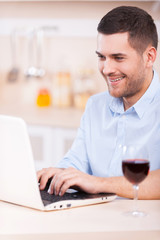 Wall Mural - Surfing the net in the kitchen.