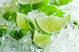 lime pieces and leaves of mint with ice