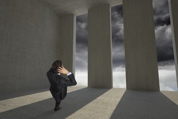 Poster - Composite image of stressed businessman with hands on head