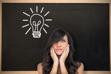Poster - Composite image of anxious brown haired model posing holding her