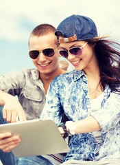 Canvas Print - teenagers looking at tablet pc