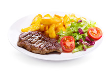 Plate Of Grilled Meat With Vegetables