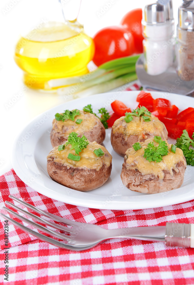 Stuffed mushrooms on plate on table close-up