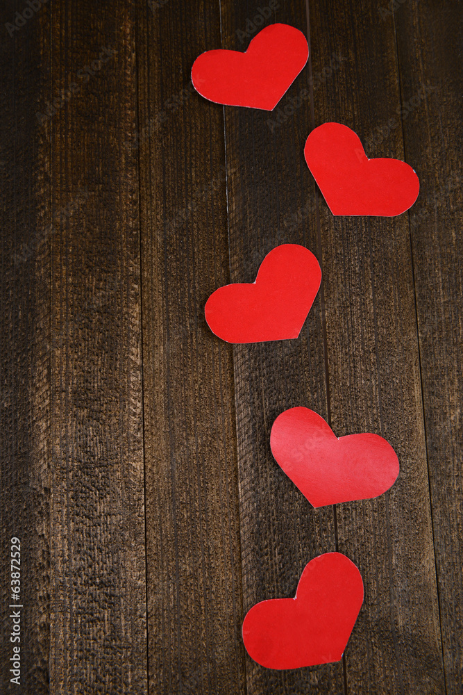 Paper hearts on wooden  background