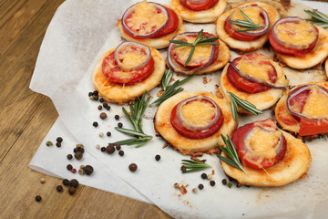 Sticker - Small pizzas on baking paper close up