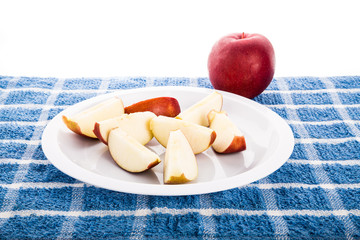 Wall Mural - Red Apple with Slices on White Plate