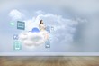 © WavebreakmediaMicro - Composite image of businesswoman holding tablet and looking up