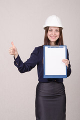 Girl in helmet standing with a folder hand