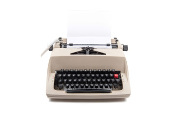 Typewriter with paper isolated on white background