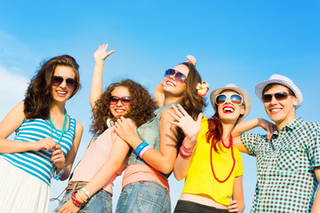 group of young people wearing sunglasses and hat