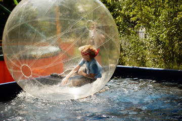 boy inside a transparent sphere