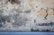 Wall & Faded Grafitti Background Texture with Abandoned Shoe