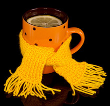 Cup Of Tea With Lemon Tied A Yellow Scarf