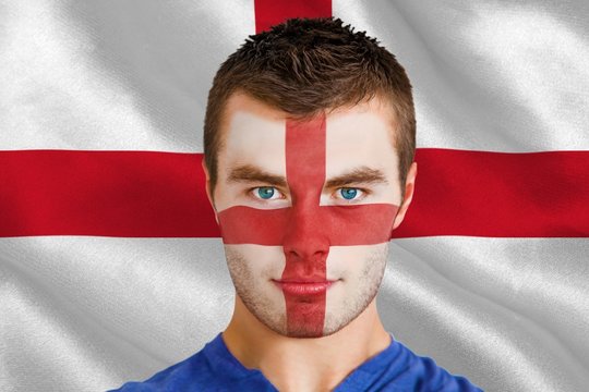 Composite image of serious young england fan with facepaint