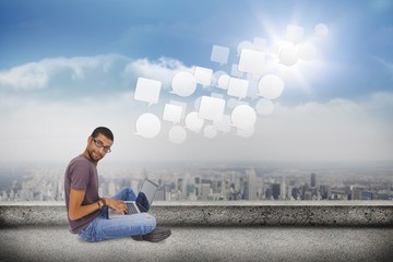 Poster - Composite image of man wearing glasses sitting on floor using la