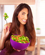 Sportive girl eating vegetarian salad