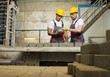 © Nejron Photo - Worker and foreman performing quality check on a factory