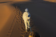 Berber man walking on desert