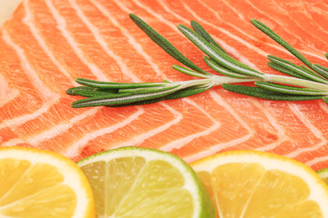 Wall Mural - Closeup of salmon steak with rosemary.