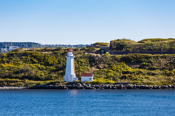 Sticker - White Lighthouse on Green Grassy Coast