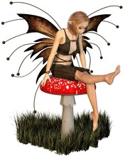 Pretty Fairy Sitting On A Toadstool