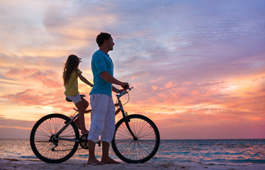 Wall Mural - Father and daughter on a bike