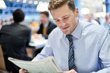 Wall Mural - Young businessman in a restaurant