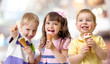 © Andrey Kuzmin - funny children group kidding with ice cream on party