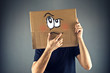 © Bits and Splits - Man thinking with cardboard box on his head